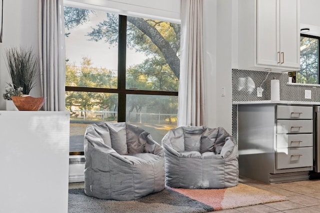 living area featuring light tile patterned floors