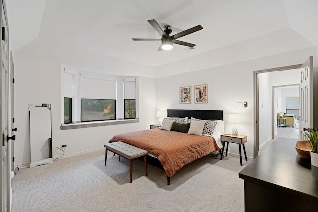 bedroom featuring ceiling fan and light colored carpet