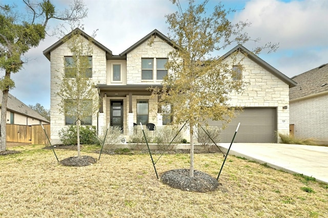 view of front of home with a garage and a front lawn