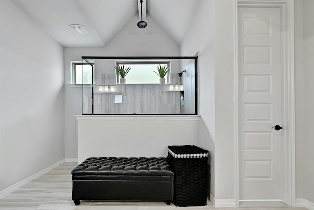 interior space featuring beamed ceiling and hardwood / wood-style floors