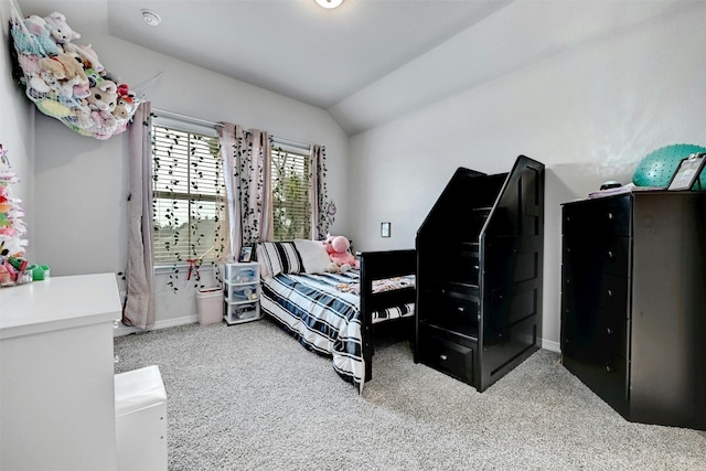 bedroom featuring carpet floors and lofted ceiling