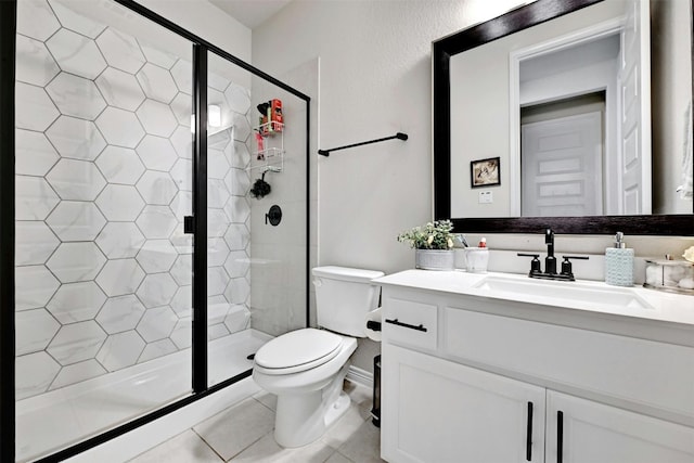 bathroom with vanity, walk in shower, tile patterned floors, and toilet