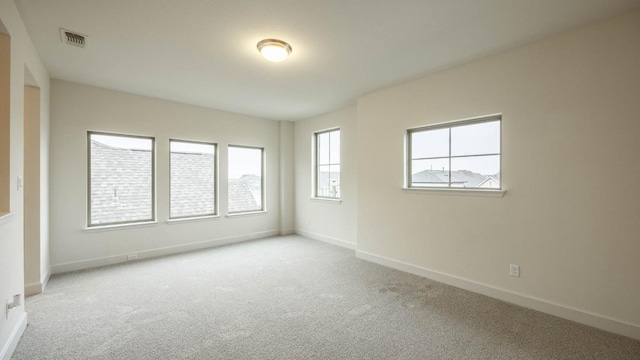 empty room featuring light carpet