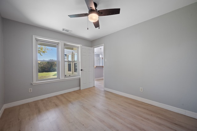 unfurnished room featuring ceiling fan and light hardwood / wood-style flooring