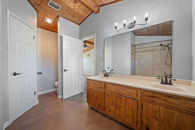 bathroom with wooden ceiling, toilet, vaulted ceiling with beams, vanity, and ceiling fan