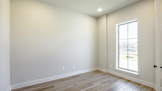 unfurnished room with light hardwood / wood-style flooring