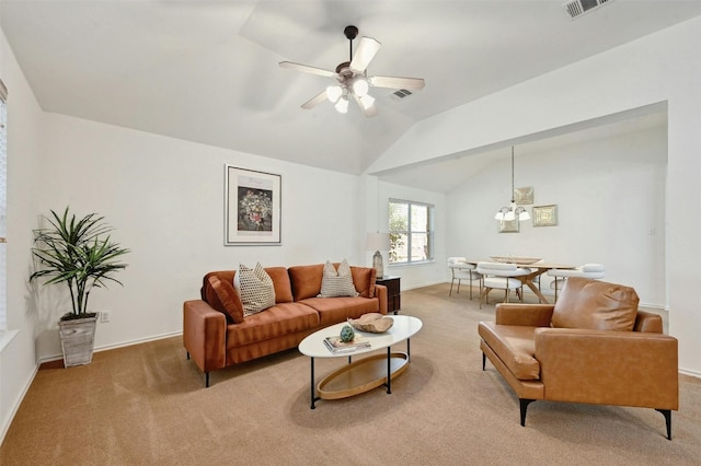 living room with carpet floors, lofted ceiling, and ceiling fan