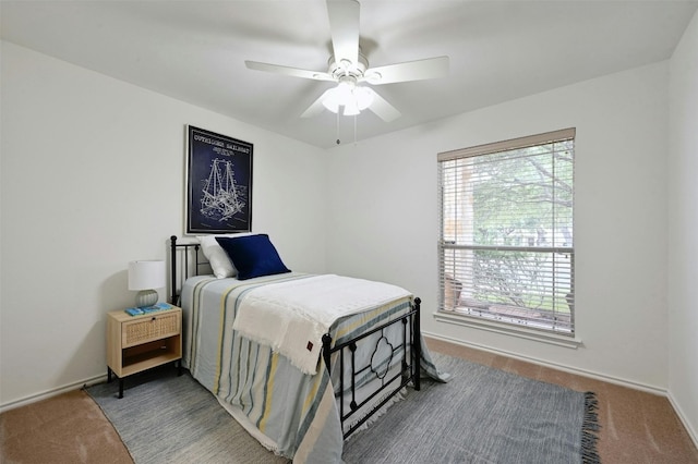 carpeted bedroom featuring ceiling fan