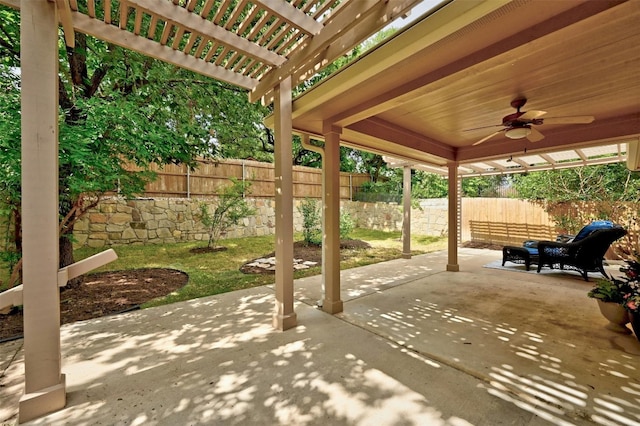 view of patio / terrace with ceiling fan and a pergola