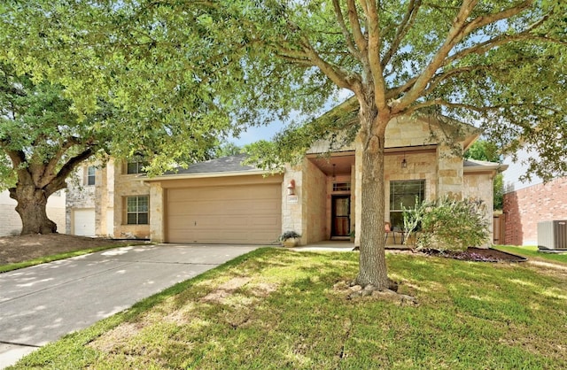 view of front of property featuring cooling unit and a front yard