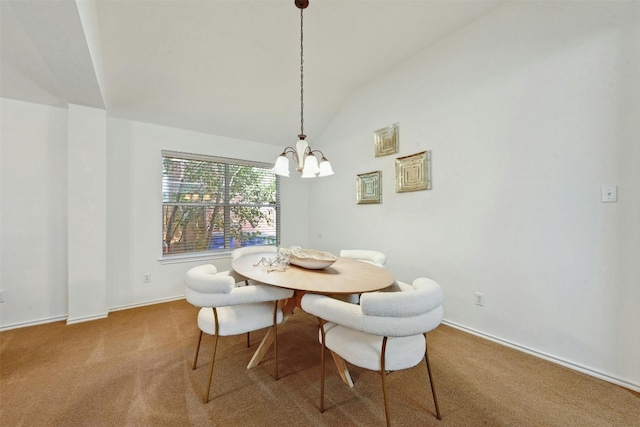 dining space featuring carpet flooring, an inviting chandelier, and lofted ceiling