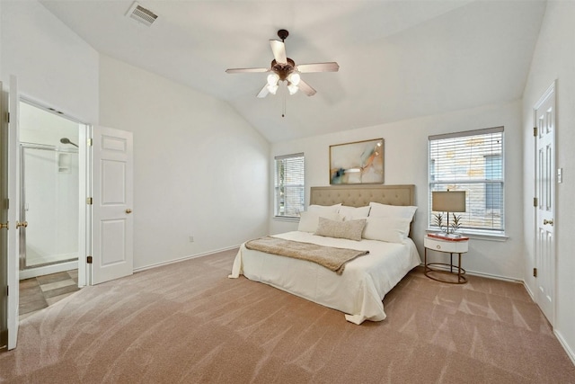 carpeted bedroom featuring ceiling fan and vaulted ceiling