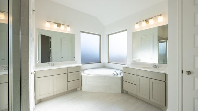 bathroom featuring tile patterned floors, vanity, lofted ceiling, and shower with separate bathtub