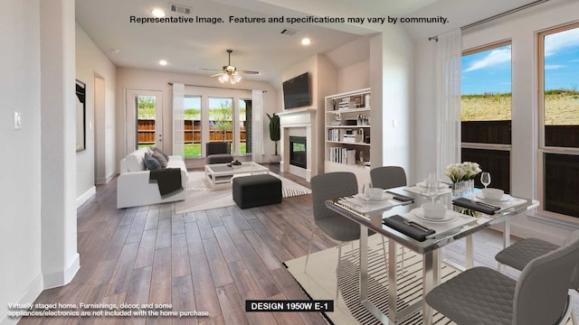 dining area with wood-type flooring and ceiling fan