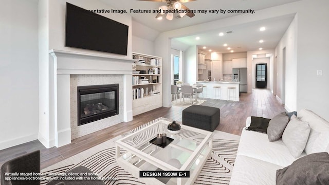 living room with hardwood / wood-style floors and ceiling fan