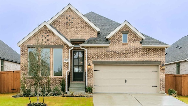 view of front facade with a garage and a front yard