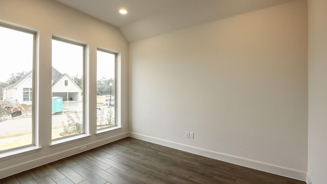 176 Plumbago Loop, Bastrop, TX 78602 - unfurnished room featuring dark wood-style floors, vaulted ceiling, and recessed lighting