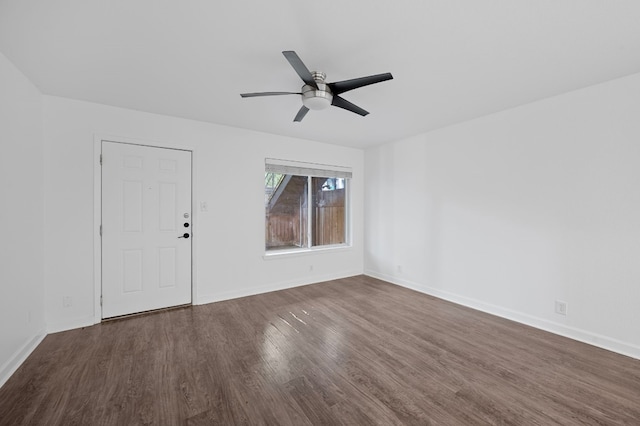 unfurnished room with ceiling fan and dark hardwood / wood-style floors