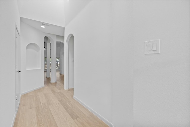 hall with light hardwood / wood-style floors