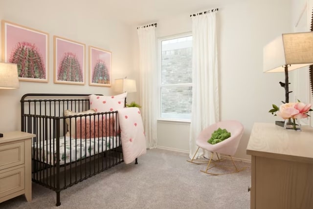 bedroom featuring light carpet, a nursery area, and multiple windows