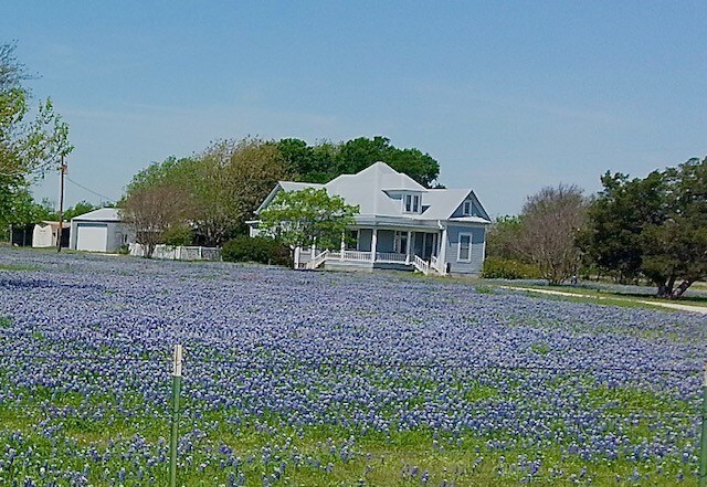 view of front of property with a garage and a porch