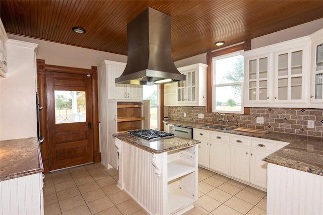 kitchen with island range hood, appliances with stainless steel finishes, open shelves, a sink, and light tile patterned flooring