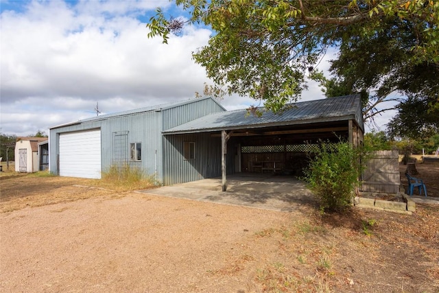 view of outbuilding featuring driveway