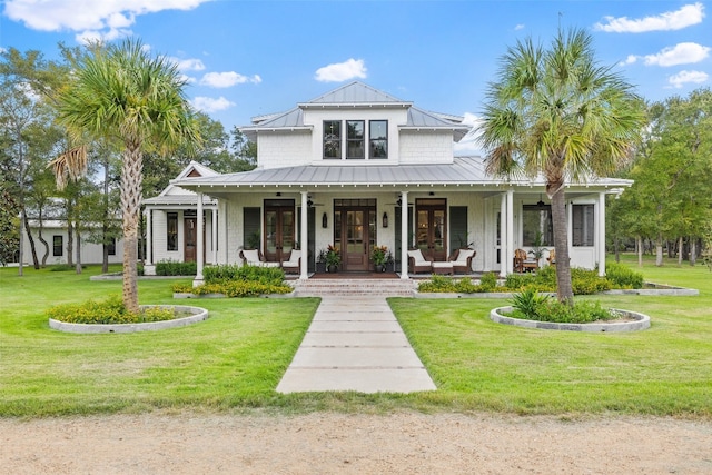 modern inspired farmhouse with covered porch and a front lawn