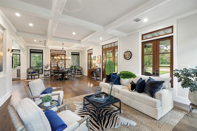 living room featuring french doors, hardwood / wood-style flooring, and a healthy amount of sunlight