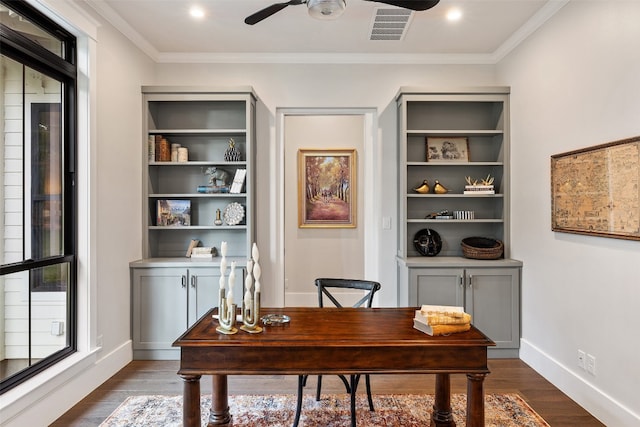 office space featuring dark hardwood / wood-style floors, ceiling fan, and ornamental molding