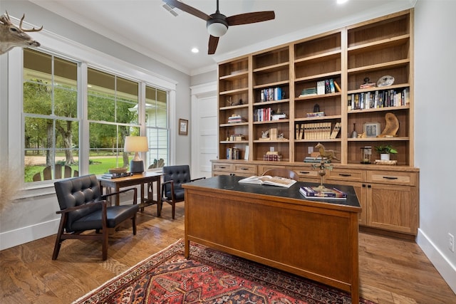 office area with dark hardwood / wood-style floors, ceiling fan, and crown molding