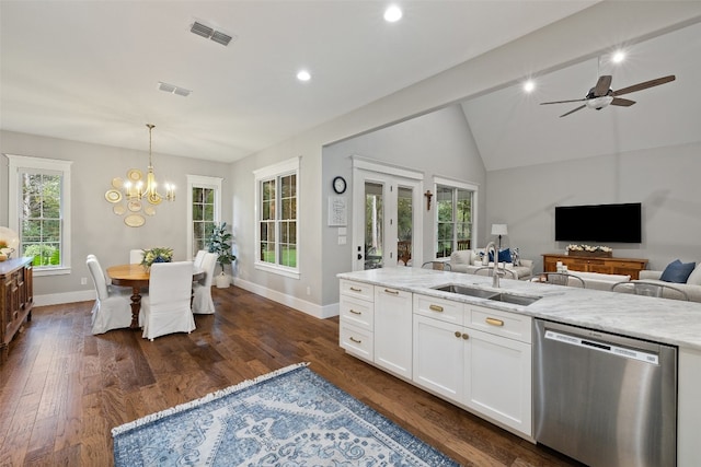 kitchen with dark hardwood / wood-style flooring, white cabinets, sink, pendant lighting, and dishwasher