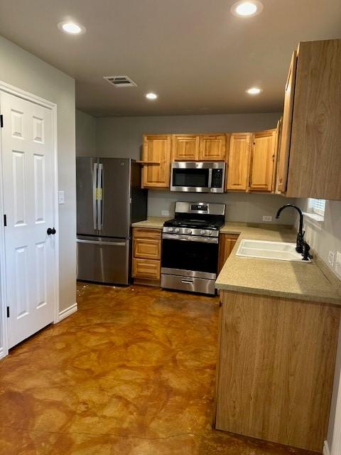 kitchen featuring stainless steel appliances and sink