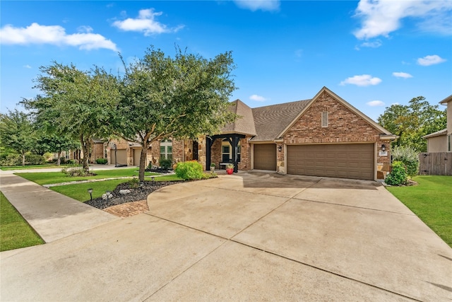 view of front facade featuring a garage and a front yard