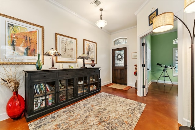 foyer featuring ornamental molding