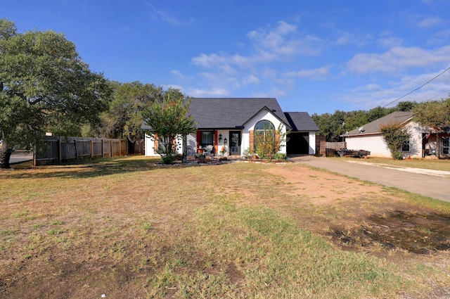 view of front facade with a garage and a front yard