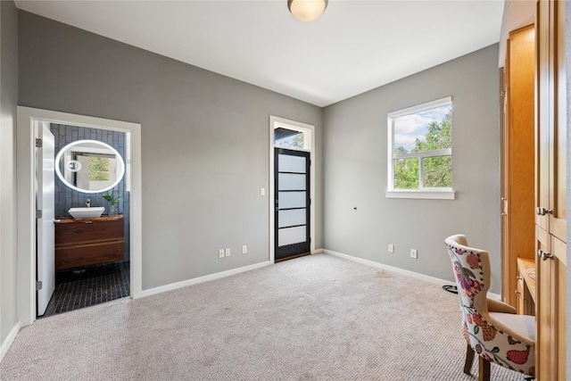 1310 S 1st St Unit 300, Austin, TX 78704 - bedroom featuring carpet floors, multiple windows, and ensuite bath