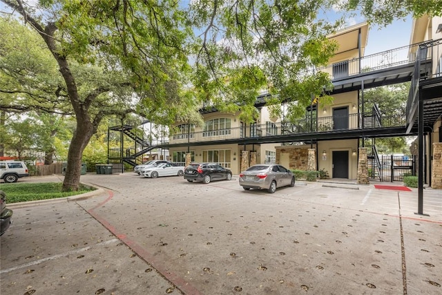 1310 S 1st St Unit 300, Austin, TX 78704 - view of property with uncovered parking and stairway