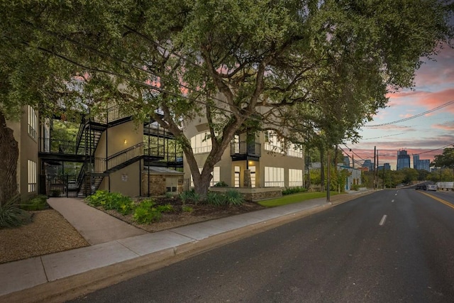 1310 S 1st St Unit 300, Austin, TX 78704 - view of asphalt street featuring stairs, sidewalks, and curbs