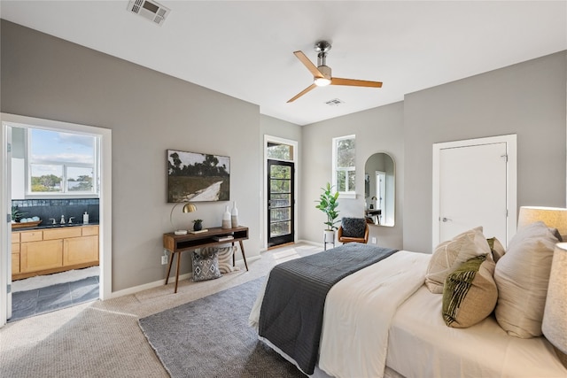 bedroom featuring ceiling fan and light colored carpet