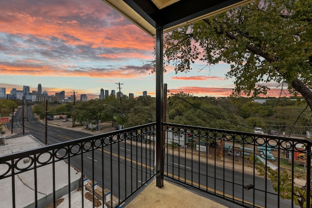 view of balcony at dusk