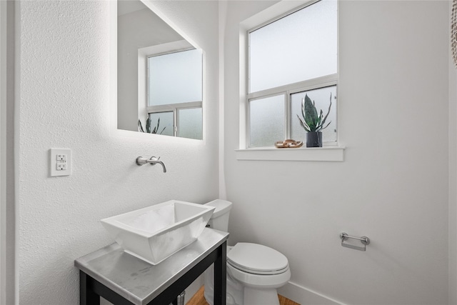 bathroom with toilet and sink