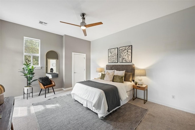 1310 S 1st St Unit 300, Austin, TX 78704 - carpeted bedroom with arched walkways and a ceiling fan
