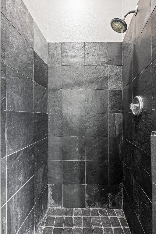 bathroom with tiled shower