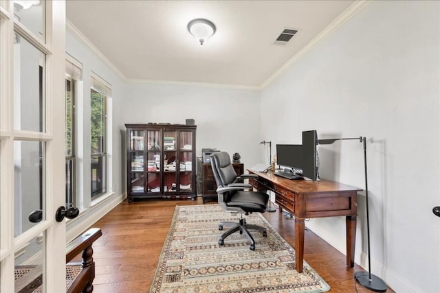 office with hardwood / wood-style flooring and ornamental molding