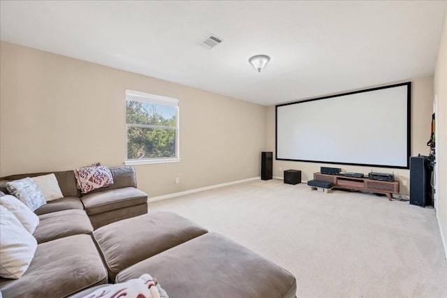 carpeted cinema with visible vents and baseboards