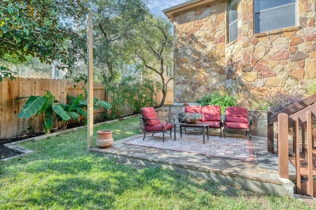 view of yard featuring a patio, fence, and an outdoor living space