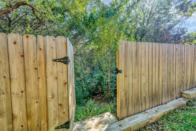 view of gate with fence