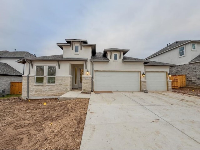 prairie-style house featuring a garage