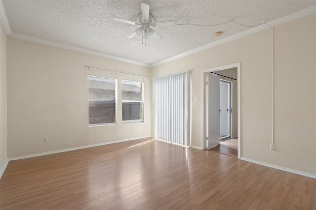 spare room with hardwood / wood-style floors, ceiling fan, a textured ceiling, and ornamental molding